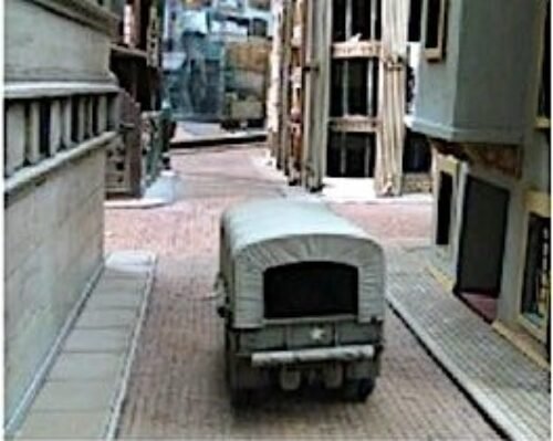 Above Placed for effect! The streets in 'Logistics' are narrow, as indicated by placing a 1:35 scale US 21/2 ton truck.